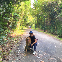 Yan Zhen with dog on a walk