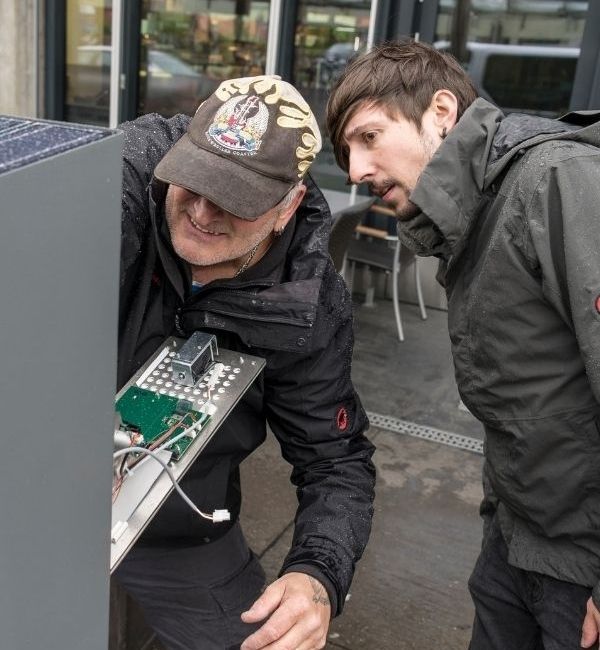 two systems engineers working on the taxomex park meter