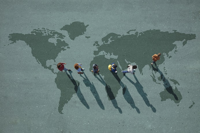 people walking over world map