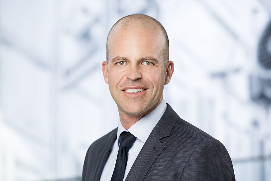 portrait of Marcel Härtlein, Global Head Transformation at the Emmi Group