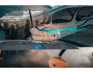 E-Sling first 4-seater electric aircraft in hangar.