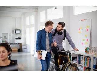 Sustainable office - two men with bicycle