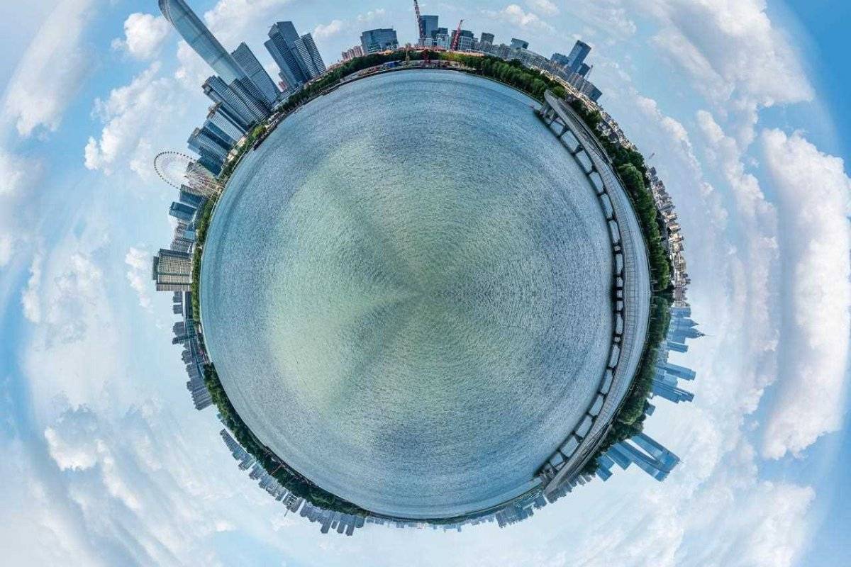 360 degree photo of a city near a river